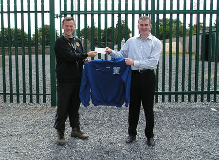 Aodh Ruadh Summer Camp organiser Sylvester Maguire (left) receives a cheque from perennial summer camp supporter Martin McGlynn of McDevitt and McGlynn Certified Accountants and Registered Auditors, Ballyshannon for summer camp sweat shirts and T-Shirts.