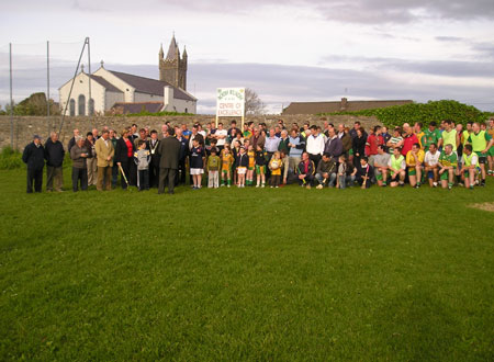 Tom Daly gives a speech to the large crowd assembled for the ceremonial turning of the first sod.