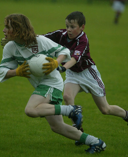 Pauric Patton evades close attention from a Termon tackler.
