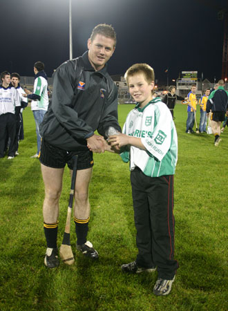 Ulster player, Paddy McArdle, presents Aodh Ruadh under 12 captain, Tommy Gillespie with his medal at the interprovincial games in McCumhaill Park, Ballybofey.