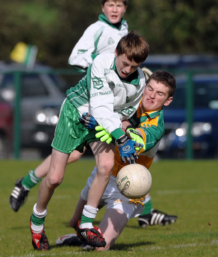 Aodh Ruadh's David McGurrin tussles with Buncrana's Stephen Nelson during Saturday's final.