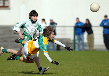 Buncrana's Darrach O'Connor goes flying under a strong challenge during Saturday's final.