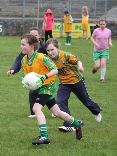 The underage girls footballers are put through their paces.