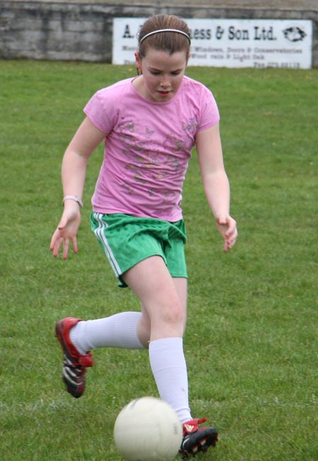 The underage girls footballers are put through their paces.
