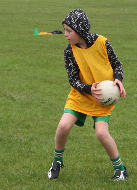 The underage girls footballers are put through their paces.