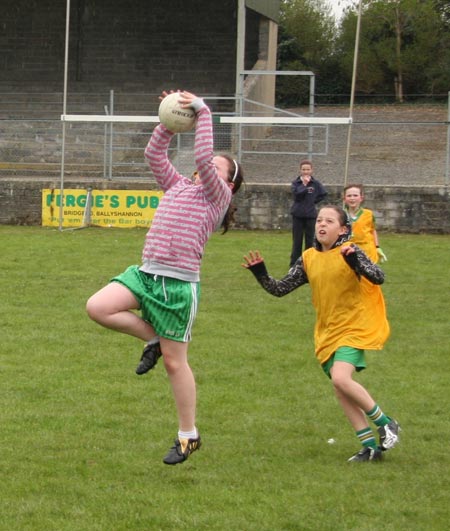 The underage girls footballers are put through their paces.