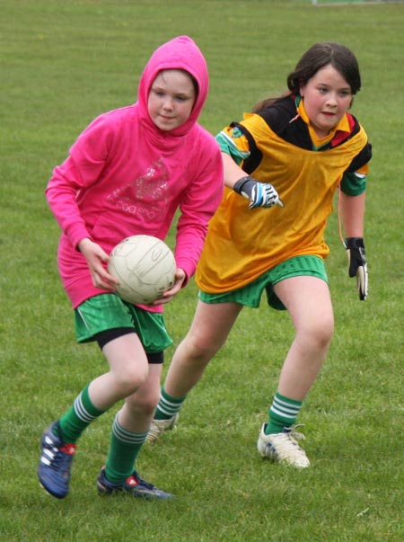 The underage girls footballers are put through their paces.