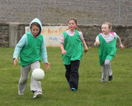 The underage girls footballers are put through their paces.