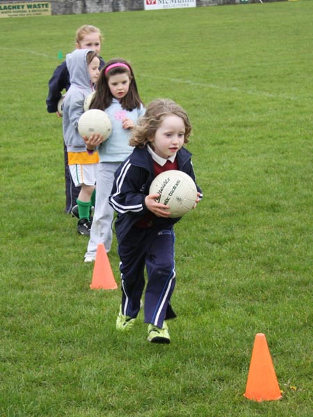 The underage girls footballers are put through their paces.