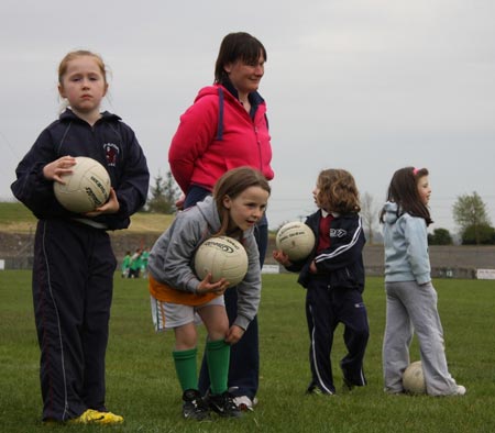 The underage girls footballers are put through their paces.