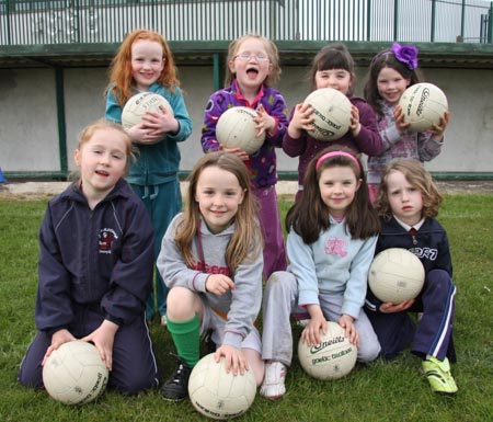 The underage girls footballers are put through their paces.