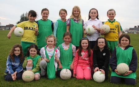 The underage girls footballers are put through their paces.