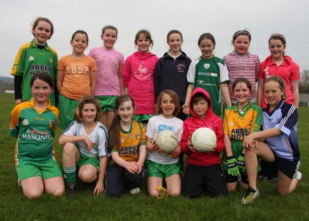 The underage girls footballers are put through their paces.