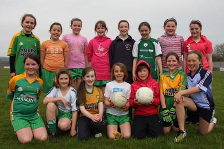 The underage girls footballers are put through their paces.